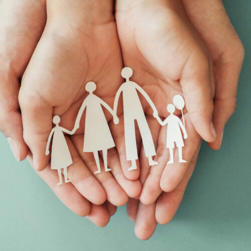 hands holding paper family cutout, family home, foster care, homeless support, social distancing, world mental health day, Autism support,homeschooling education, lockdown concept